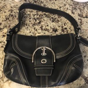 Small black leather Coach handbag.